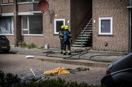 Explosie bij brand in portiekwoning