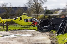 Persoon met been onder tractor in Haarlem